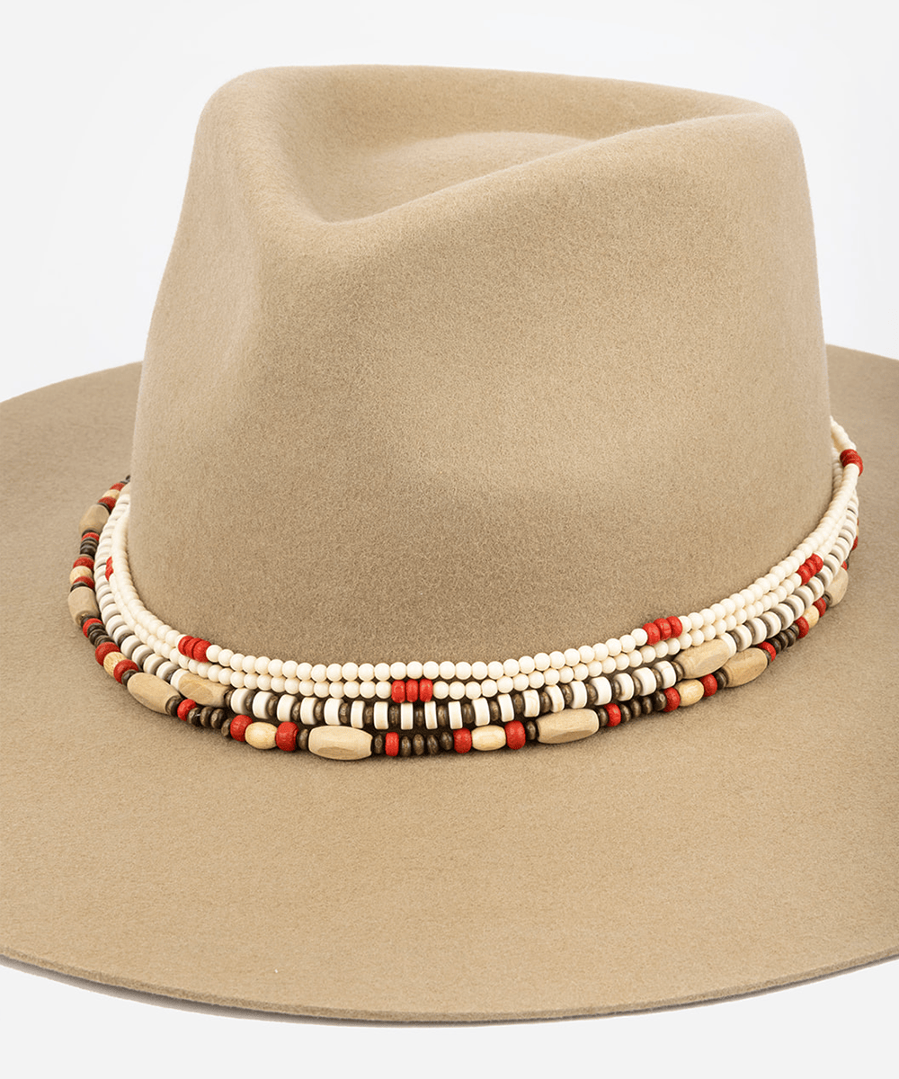 A natural colored layered beaded hat band on a hat on a plain background #color_natural