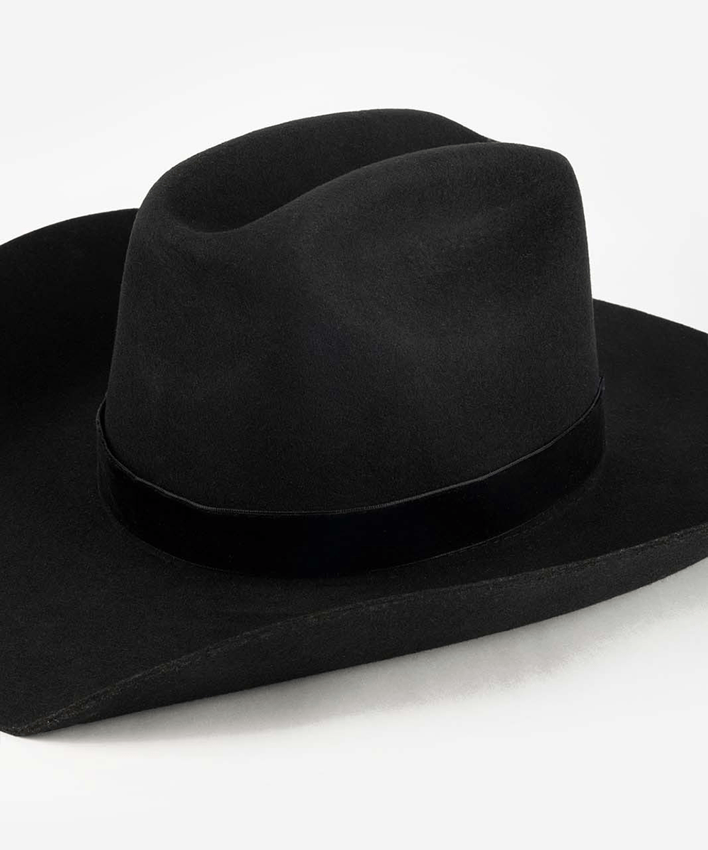 Black cowboy hat with a black velvet chain band on a white background #color_black