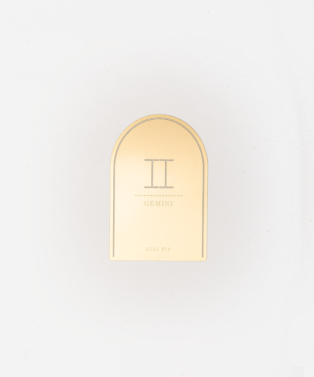Gold 'Gemini' zodiac sign plaque on a light gray background #color_gold