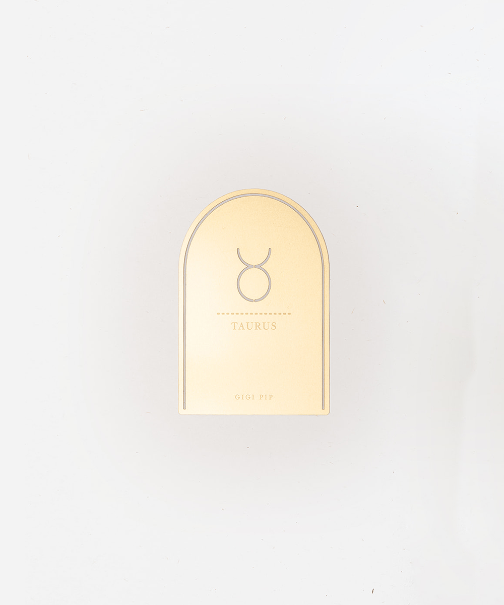 Gold 'Taurus' zodiac sign plaque on a light gray background #color_gold
