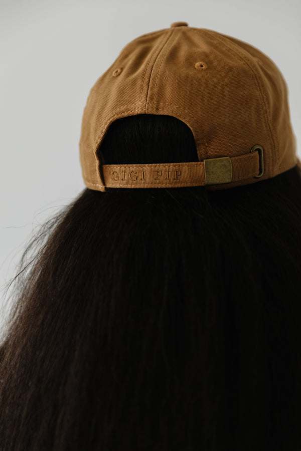 Gigi Pip ball caps for women - Laci Ball Cap - 100% cotton women's ball cap with eyelits on each of the 6 panels, featuring the Gigi Pip logo embroidered above the adjustable closure in the back [camel]