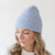 Gigi Pip beanies for women - Collins Beanie - soft knit ribbed women's beanie featuring a fold up brim with a rose gold Gigi Pip logo pin on the side of the fold [camel]