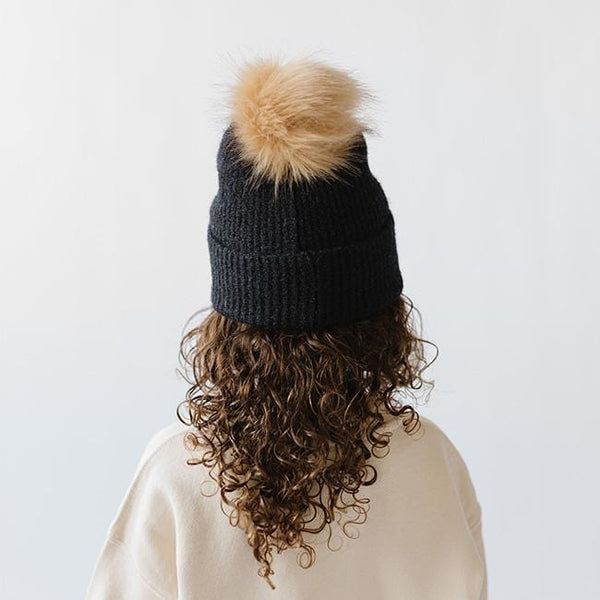 Gigi Pip beanies for kids - Milo Beanie - soft knit ribbers kid's beanie featuring a fold up brim with a rose gold Gigi Pip logo pin on the side of the fold and a pom pom on the center of the crown [midnight]
