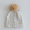 Gigi Pip beanies for kids - Milo Beanie - soft knit ribbers kid's beanie featuring a fold up brim with a rose gold Gigi Pip logo pin on the side of the fold and a pom pom on the center of the crown [oatmeal]