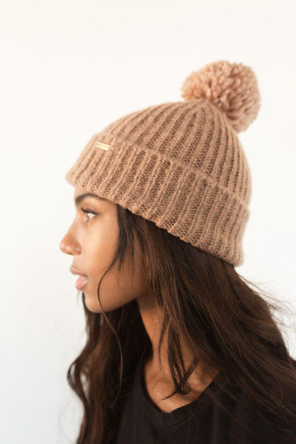 Gigi Pip beanies for women - Mo Pom Beanie - classic knit beanie with a pom on the crown, featuring the Gigi Pip logo on a metal bar on the front fold [mauve]