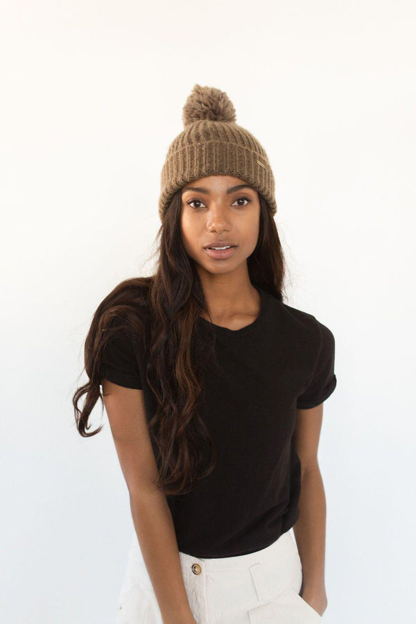 Gigi Pip beanies for women - Mo Pom Beanie - classic knit beanie with a pom on the crown, featuring the Gigi Pip logo on a metal bar on the front fold [smoke]