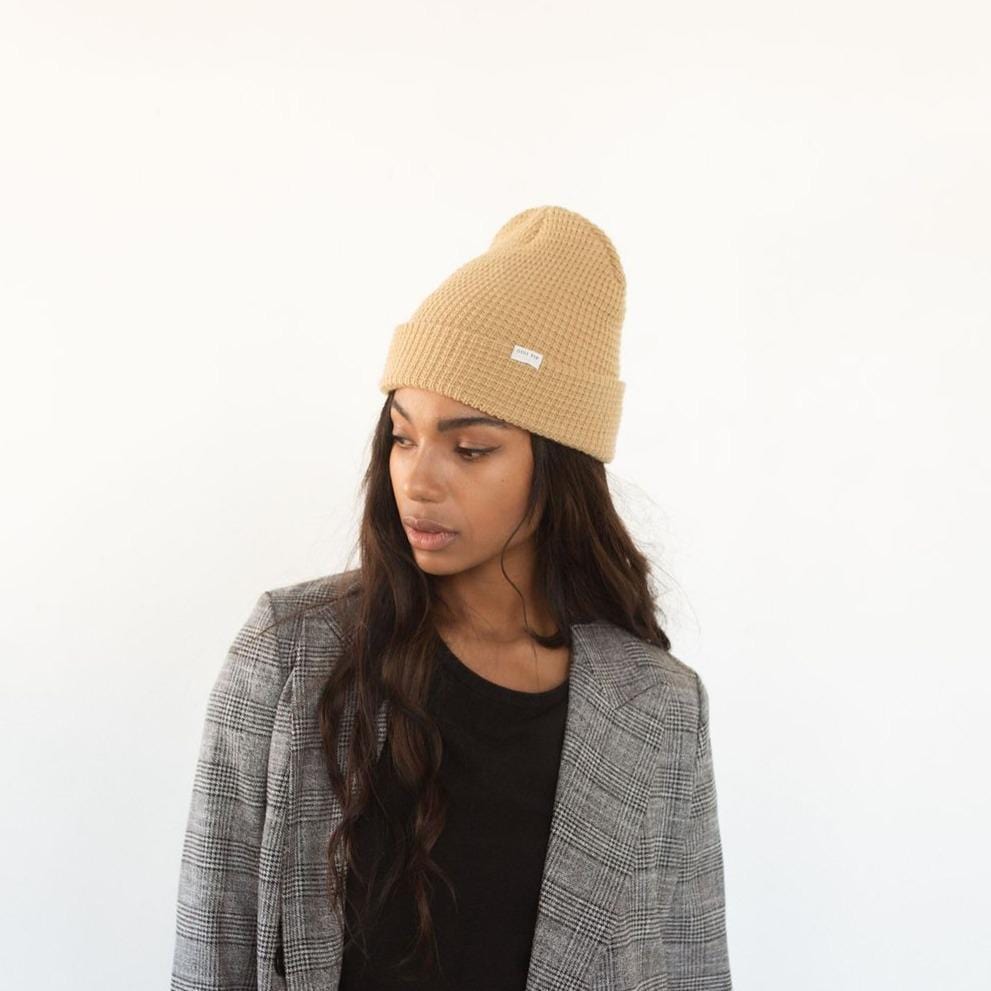 Gigi Pip beanies for women - Marsh Waffle Knit Beanie - 100% acrylic waffle knit beanie with the Gigi Pip logo on a tag over the fold [mustard]