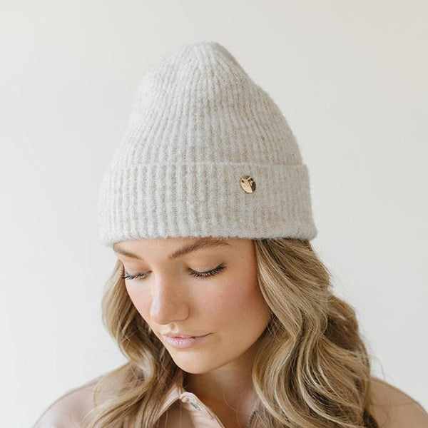 Gigi Pip beanies for women - Collins Beanie - soft knit ribbed women's beanie featuring a fold up brim with a rose gold Gigi Pip logo pin on the side of the fold [oatmeal]