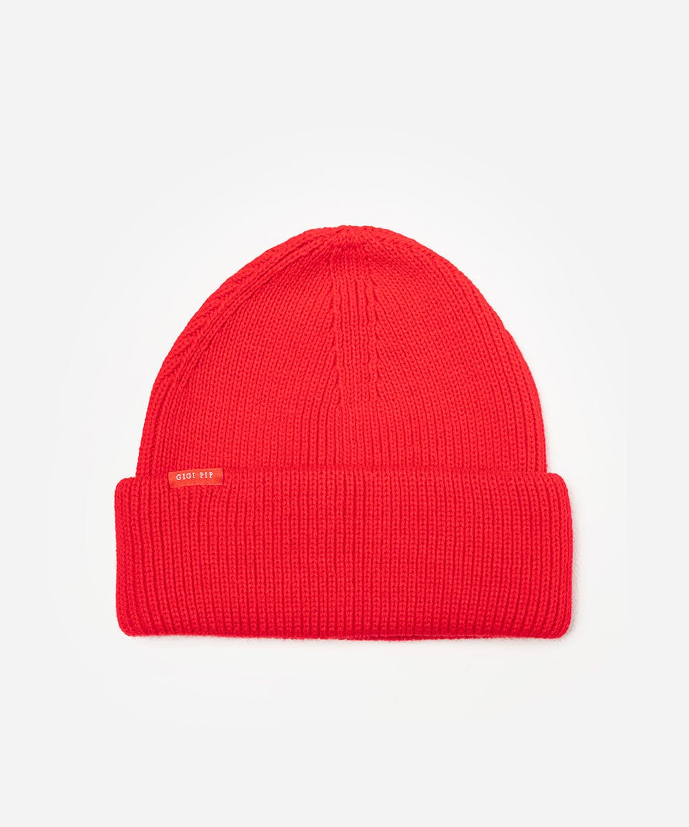 Red beanie with a small logo on a light gray background #color_red