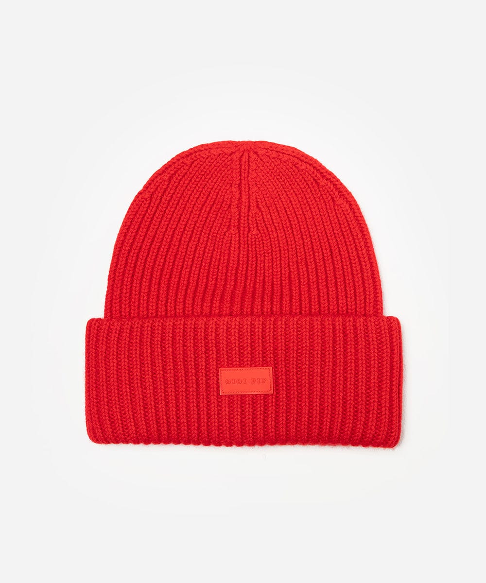Ruby red colored ribbed beanie on a white background #color_ruby red