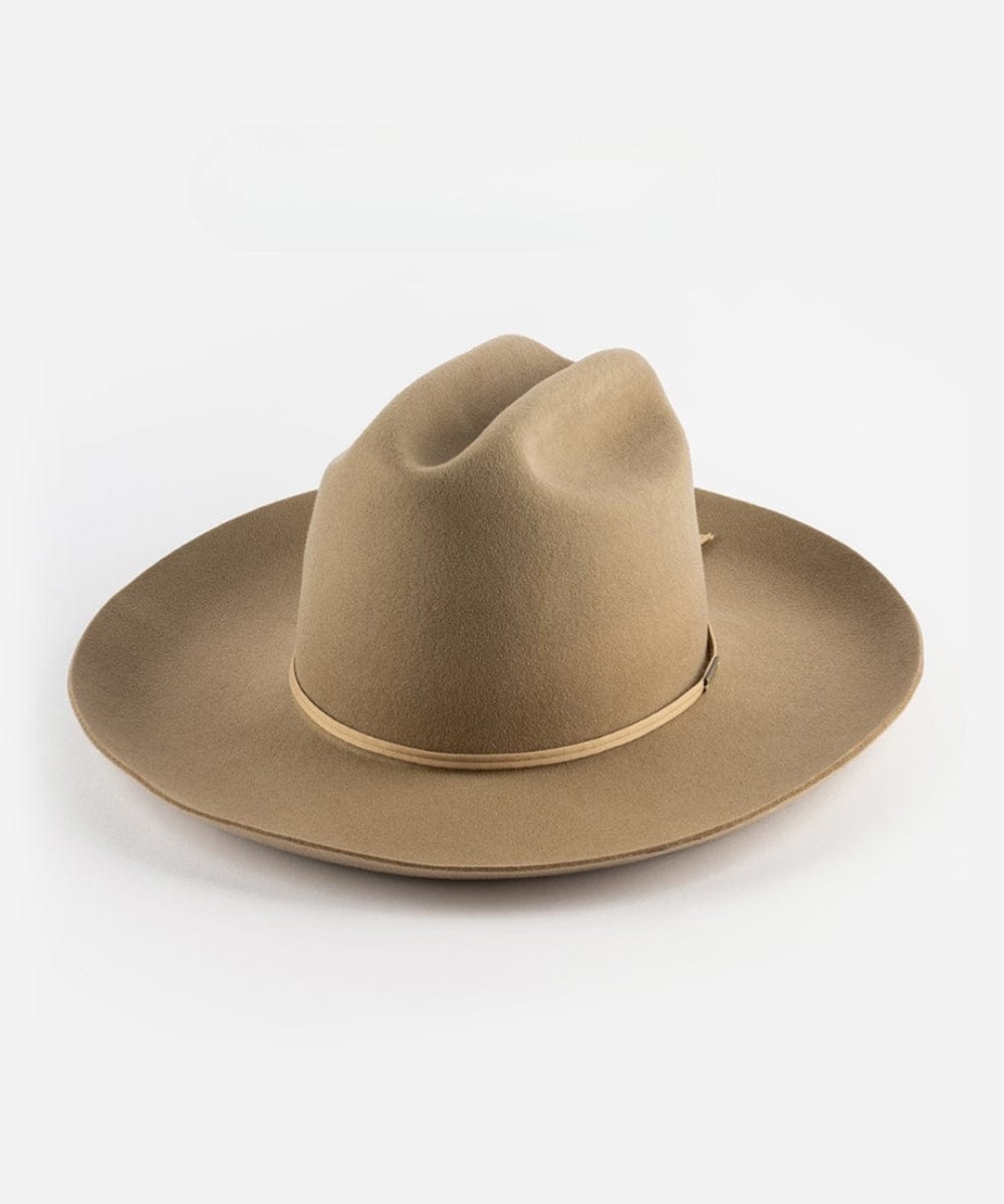 A tan cowboy hat with a hat band on a white background #color_tan