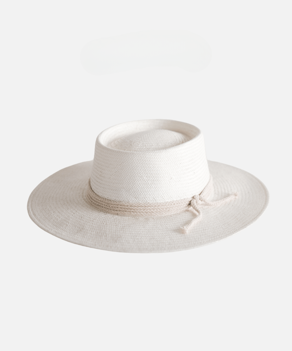 An ivory colored straw hat with a hat band on a plain background #color_ivory