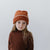 Gigi Pip beanies for kids - Kids Vail Beanie - 100% acrylic chunky knit beanie in a universal kids size featuring a comfortable plush inner band and the Gigi Pip logo on a metal bar in the front [burnt orange-cream]