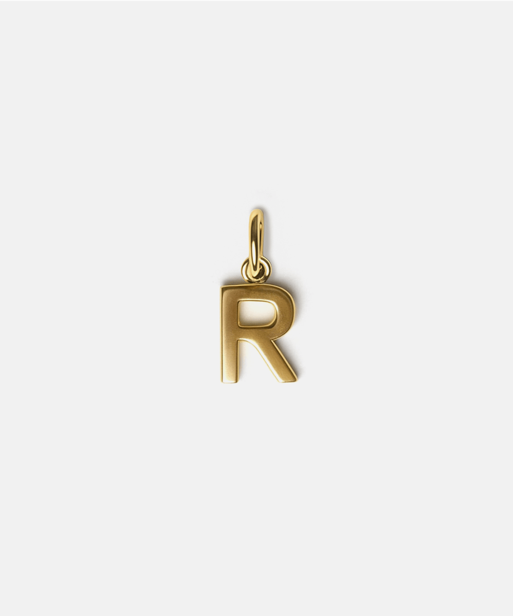 Gold letter 'R' pendant hat charm on a white background #color_gold