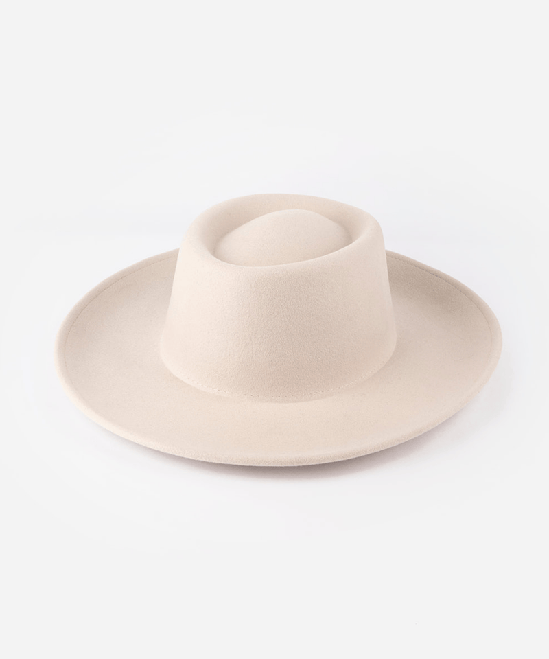 Gambler hat with an indented oval crown and an upturned brim against a white background #color_ivory