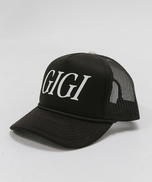 Gigi Pip trucker hats for women - Gigi Foam Trucker Hat - 100% polyester foam + mesh trucker hat with a curved brim featuring the word "Gigi" in a contrasting color as a design across the front panel [black]