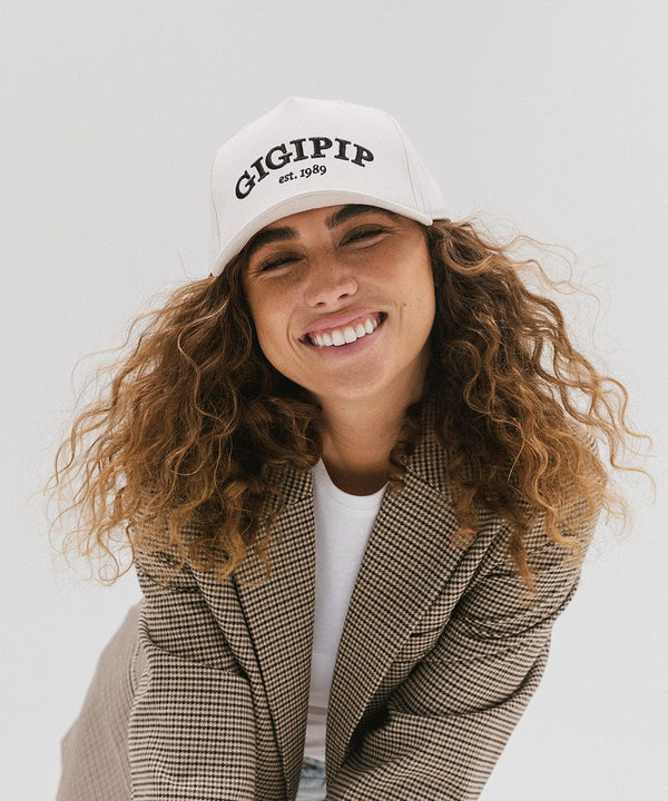 Gigi Pip trucker hats for women - Gigi Pip Canvas Trucker Hat - 100% Cotton Canvas w/ cotton sweatband + reinforced from panel with 100% polyester mesh trucker hats with gigi pip embroidered on the front panel with an adjustable velcro bag [cream]