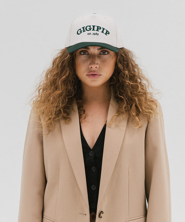 Gigi Pip trucker hats for women - Gigi Pip Canvas Trucker Hat - 100% Cotton Canvas w/ cotton sweatband + reinforced from panel with 100% polyester mesh trucker hats with gigi pip embroidered on the front panel with an adjustable velcro bag [cream-dark green]