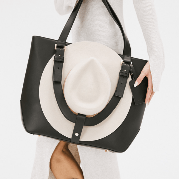 Gigi Pip luxury hat carrying totes for women - Leather Hat Carrying Tote - 100% genuine leather hat carrying tote featuring a "U" strap to cradle your hat to your bag + two interior pockets [black]