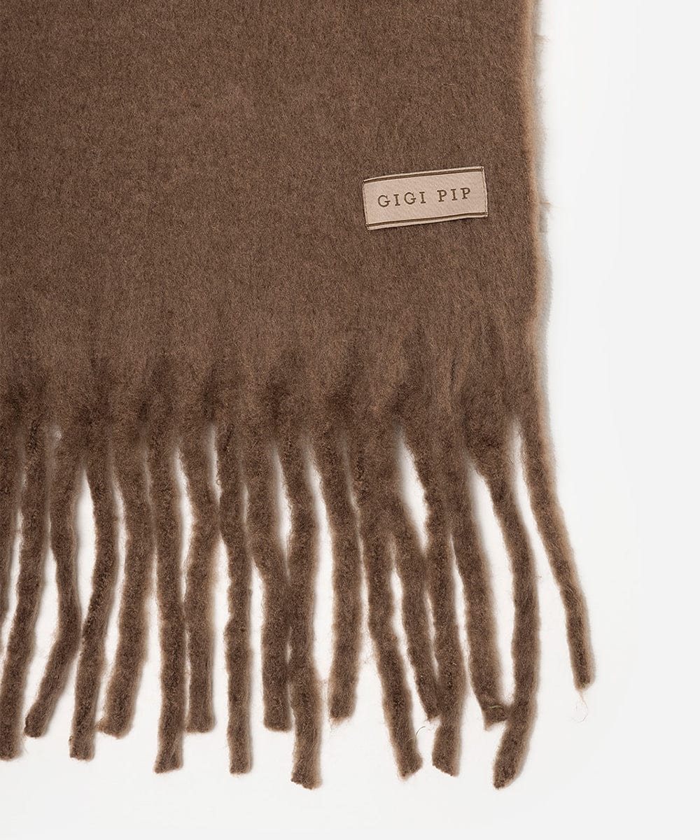 Brown scarf with fringes and 'GIGI PIP' label on a white background #color_brown
