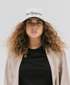 Gigi Pip trucker hats for women - Slow Morning Club Canvas Trucker Hat - 100% cotton canvas w/ cotton sweatband + reinforced from inner panel with 100% plolyester mesh trucker with Slow Morning Club embroidered on the front panel featuring an adjustable back strap [cream-dark green]