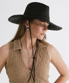 Gigi Pip straw hats for women - Ozzy Lifegaurd Hat - made of a tight weave raffia straw with a relaxed a-line brim, hand-painted leather chinstrap [black]