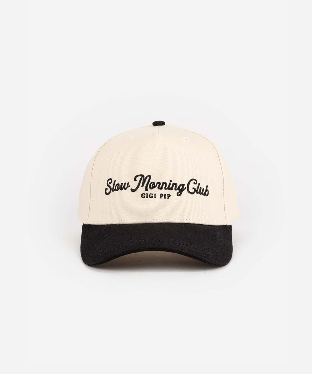 A cream and black cap with the text "Slow Morning Club", on a plain background #color_cream - black