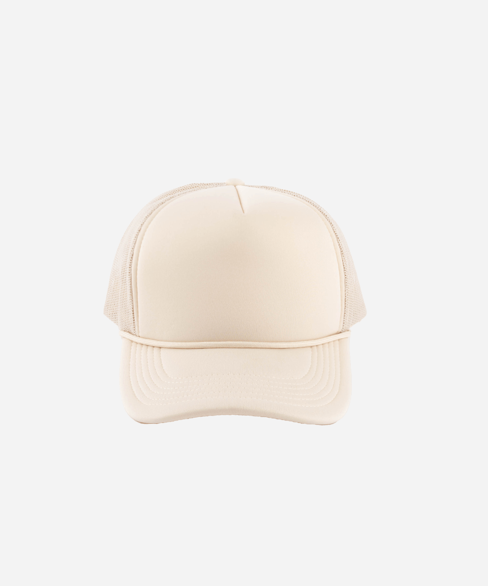 A trucker cap with mesh back on a white background #color_cream