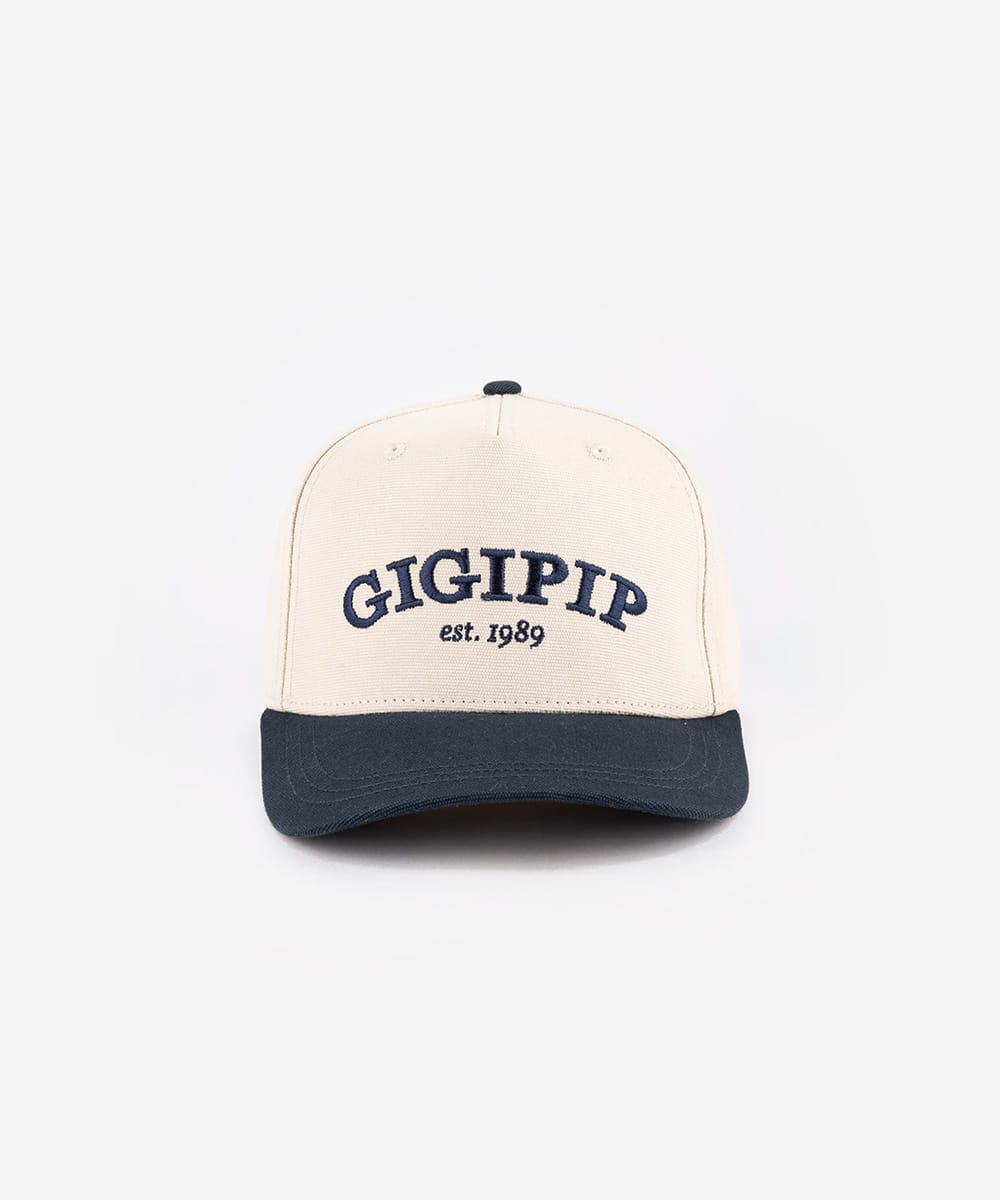 Beige and navy cap with 'GIGIPIP' branding on a white background #color_cream-navy
