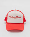 Gigi Pip trucker hats for women - Vintage Goods Foam Trucker Hat - 100% polyester foam + mesh trucker hat with a curved brim featuring the words "vintage goods" in a contrasting color as a design across the front panel [cream-vintage red]