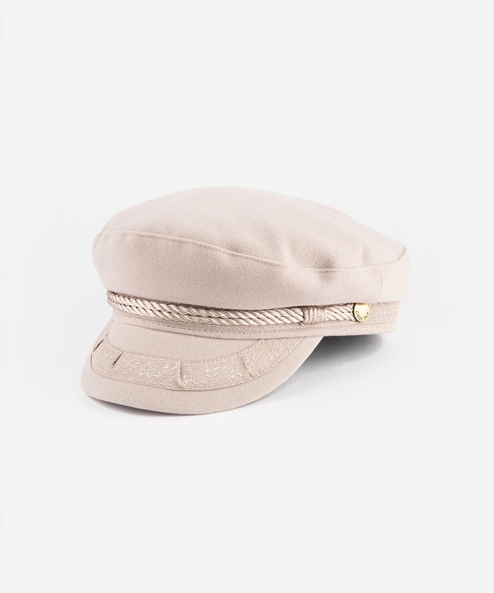 Beige cap with a gold emblem on a white background #color_ivory