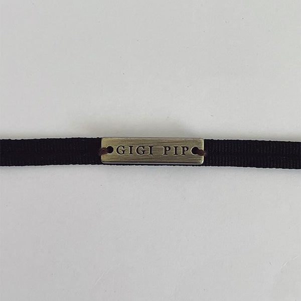 Gigi Pip hat bands + trims for women's hats - Grosgrain Band - 100% polyester grosgrain band featuring a Gigi Pip engraved metal bar and two tails where the band ties together in the back [black]