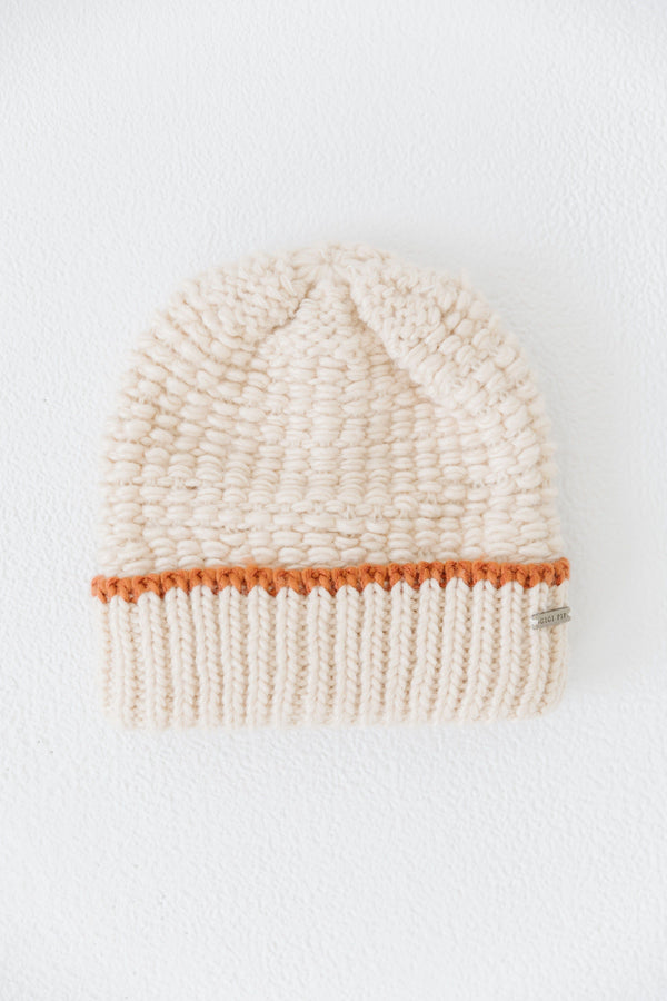 Gigi Pip beanies for women - Vail Beanie - 100% acrylic chunky knit beanie with a comfortable plush inner band, featuring the Gigi Pip logo on a metal bar in the front [cream + burnt orange]