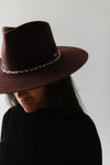 Gigi Pip felt hats for women - Raine Wide Brim Fedora - wide flat brim with a fedora crown, featuring a gold-plated removable paperclip brass chain with three faux pearls and a hand-sewn grosgrain band with the gold Gigi Pip bar around the crown, as well as a removable golden chain chinstrap [dark cherry]