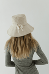 Gigi Pip bucket hats for women - 100% cotton lined bucket hat with a wide brim and featuring a tie ribbon in the back [natural]